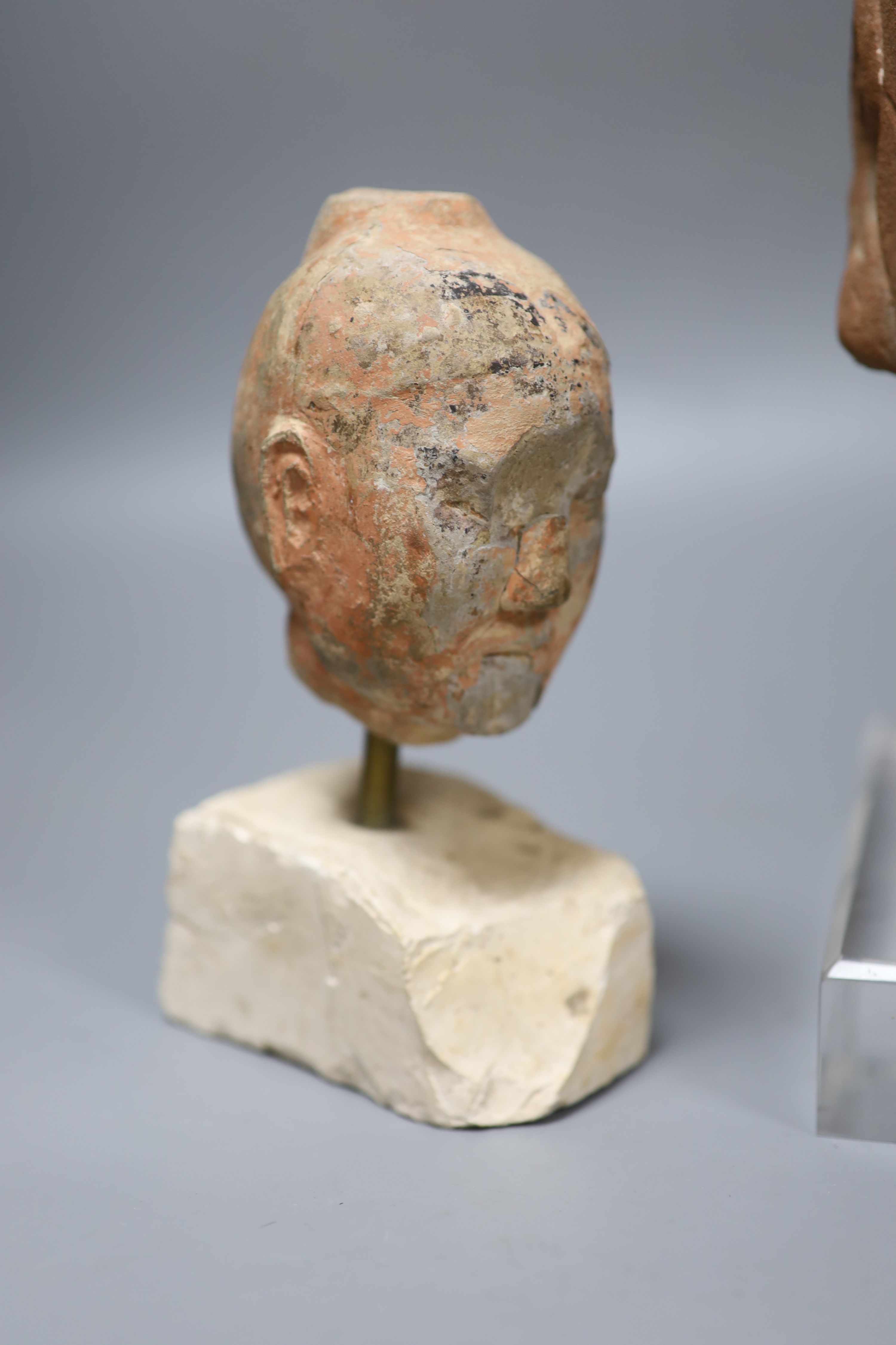 Two Chinese terracotta heads, tallest overall 30cm